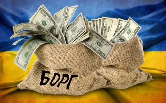 Мішок з доларами з написом БОРГ на прапорі України